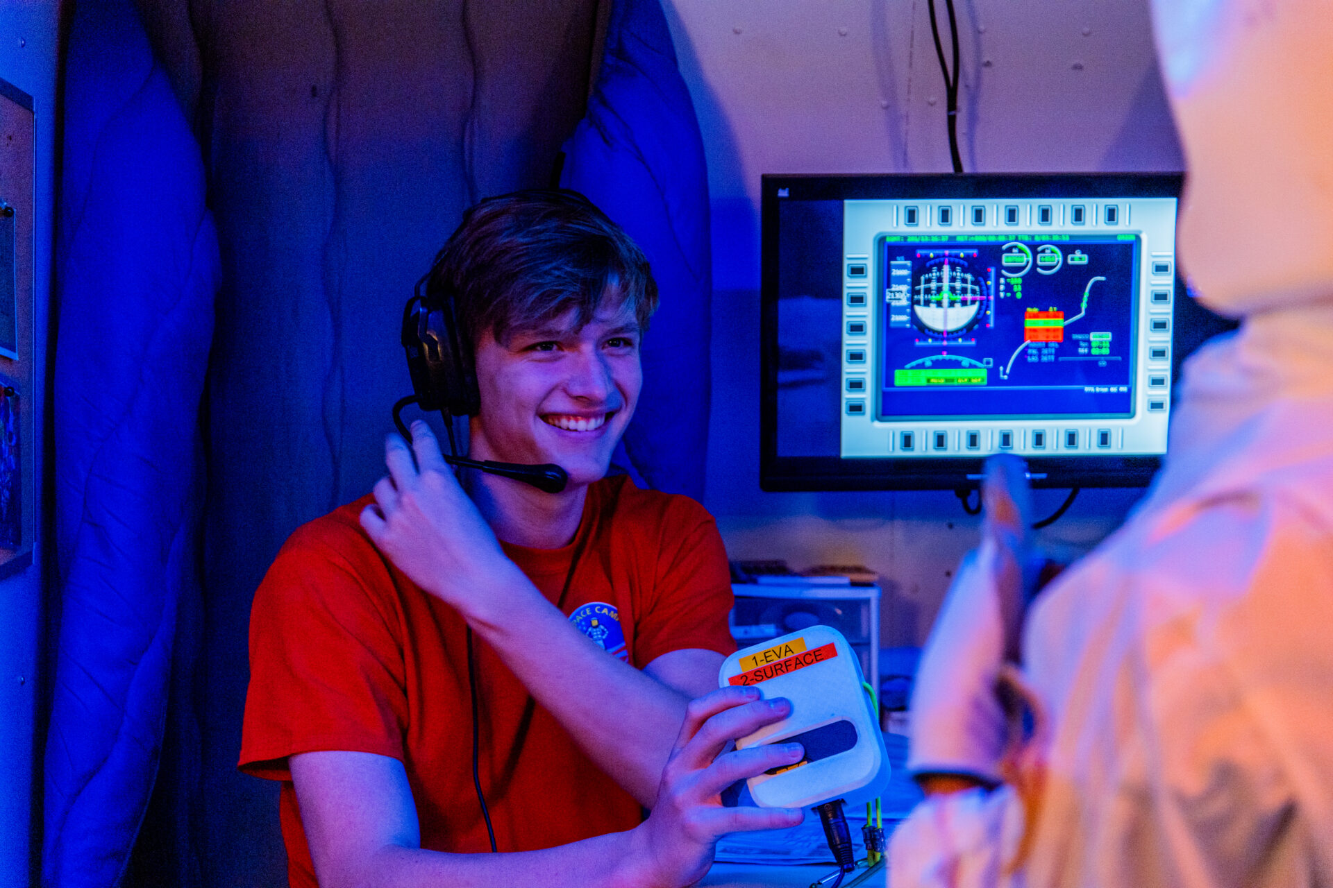 Male student taking part in a STEM challenge at Alabama Space Camp