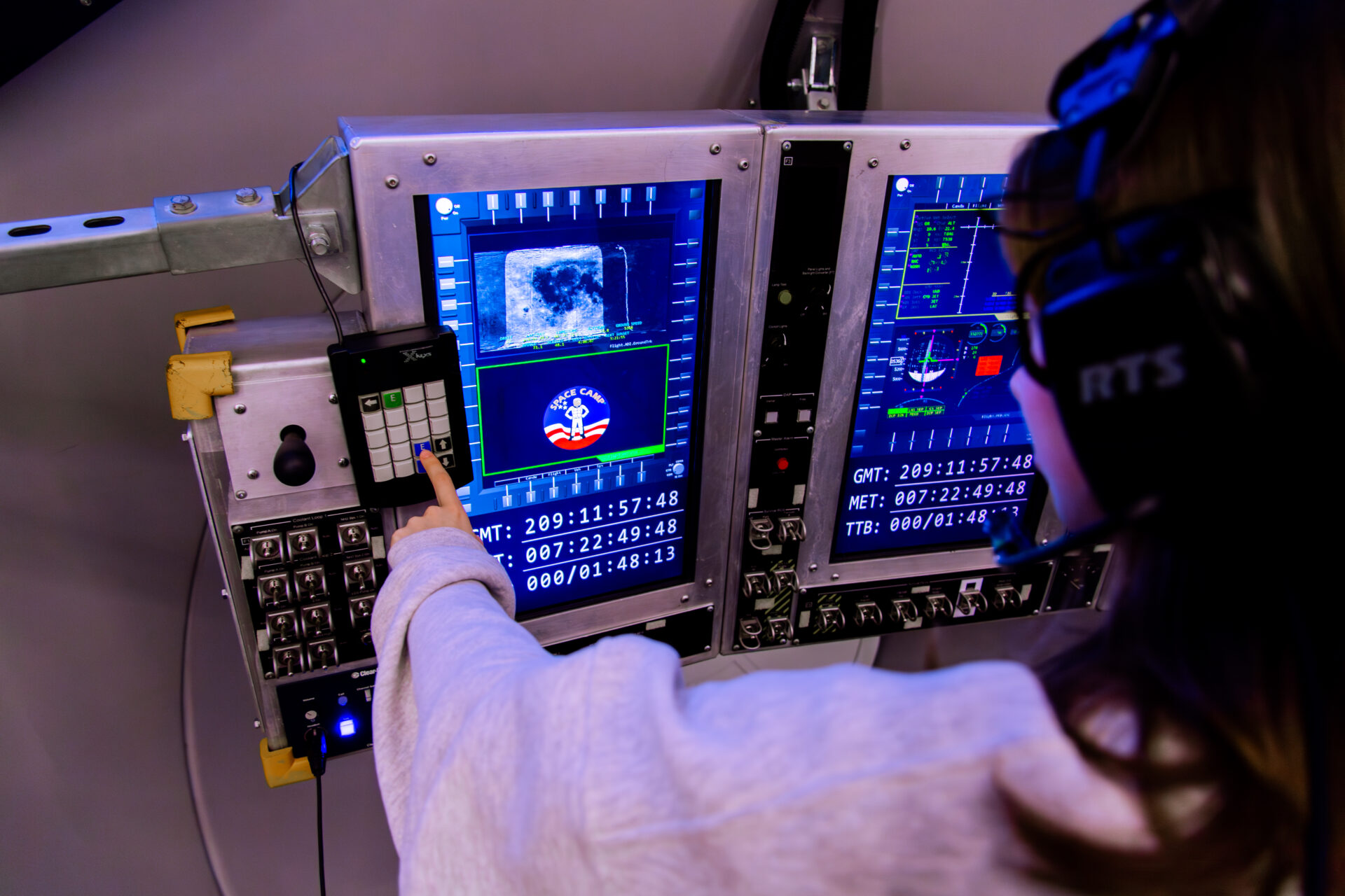 Female student using a keypad at Alabama Space Camp