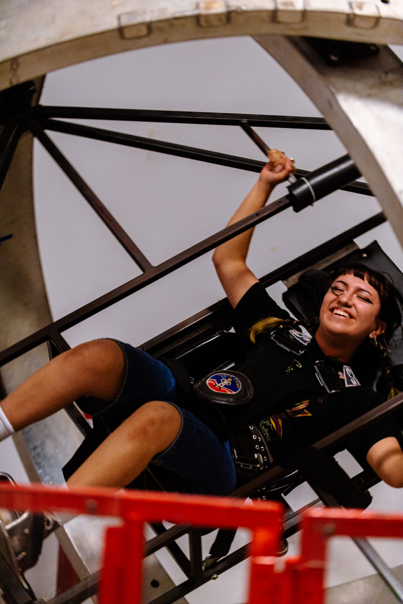 Female student on the Multi-Axis trainer at Alabama Space Camp