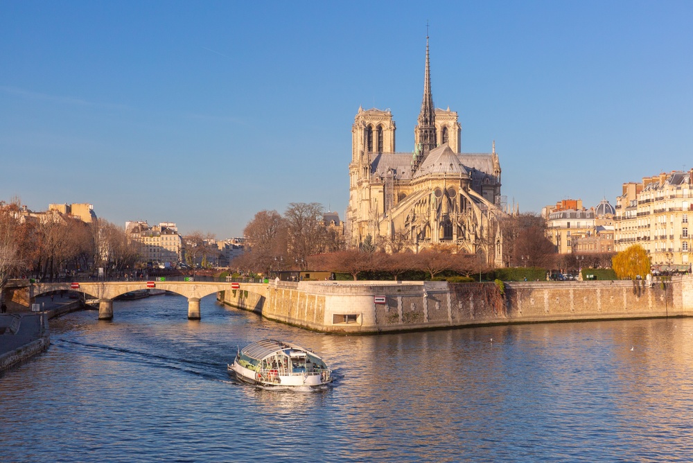 River cruise on the river Seine with Notre Dame Cathedral in the background in Paris