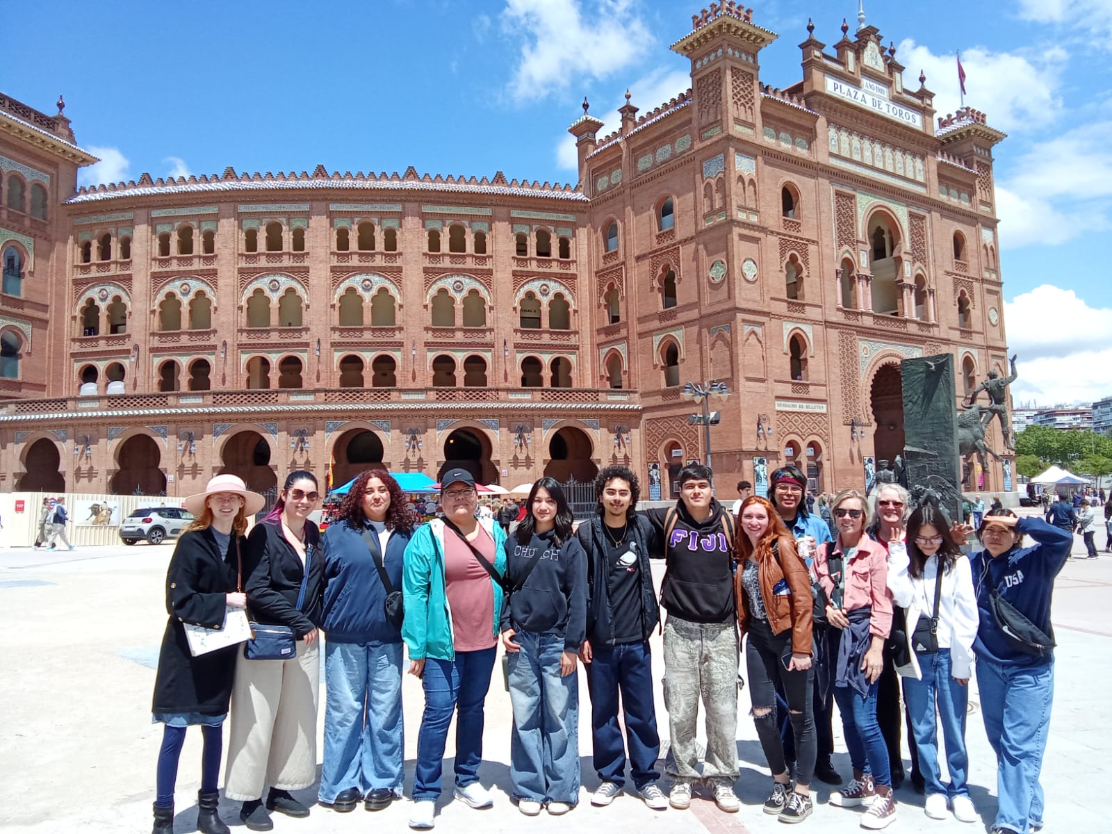 Student group posing in front of the Plaza de Toros arena in Madrid