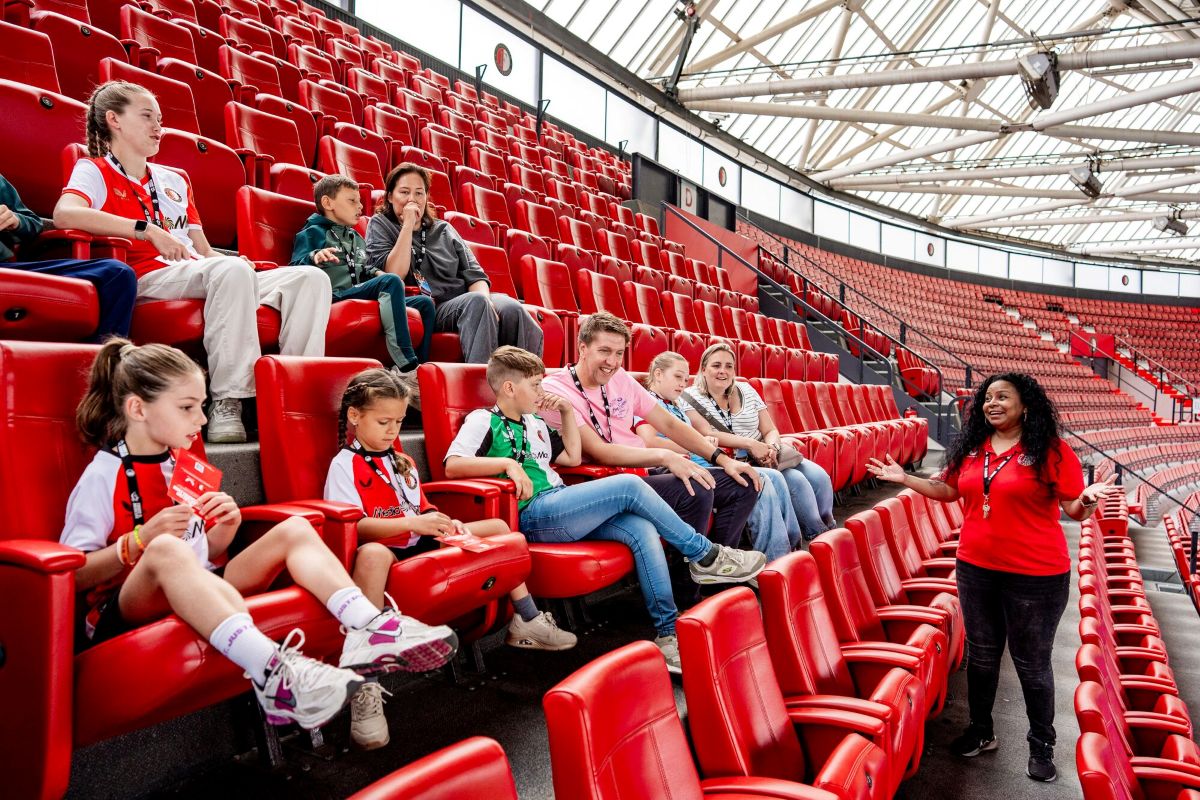 Students in the tribune at De Kuip Stadium in Rotterdam